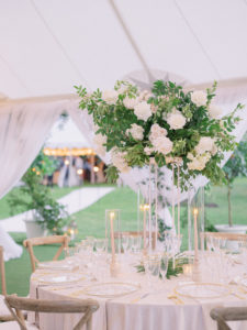 Luxurious Elegant Florida Classic Wedding Reception Decor, Wooden Cross Back Chairs, Candlesticks in Hurricane Tumblers, Tall Lush White Roses and Greenery Floral Centerpiece