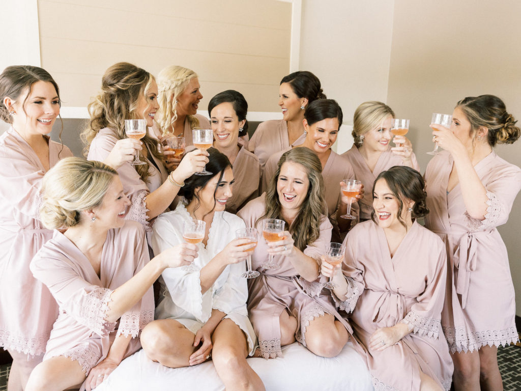 Florida Bride and Bridesmaids Wearing Matching Mauve Robes | Tampa Bay Wedding Hair and Makeup Femme Akoi Beauty Studio