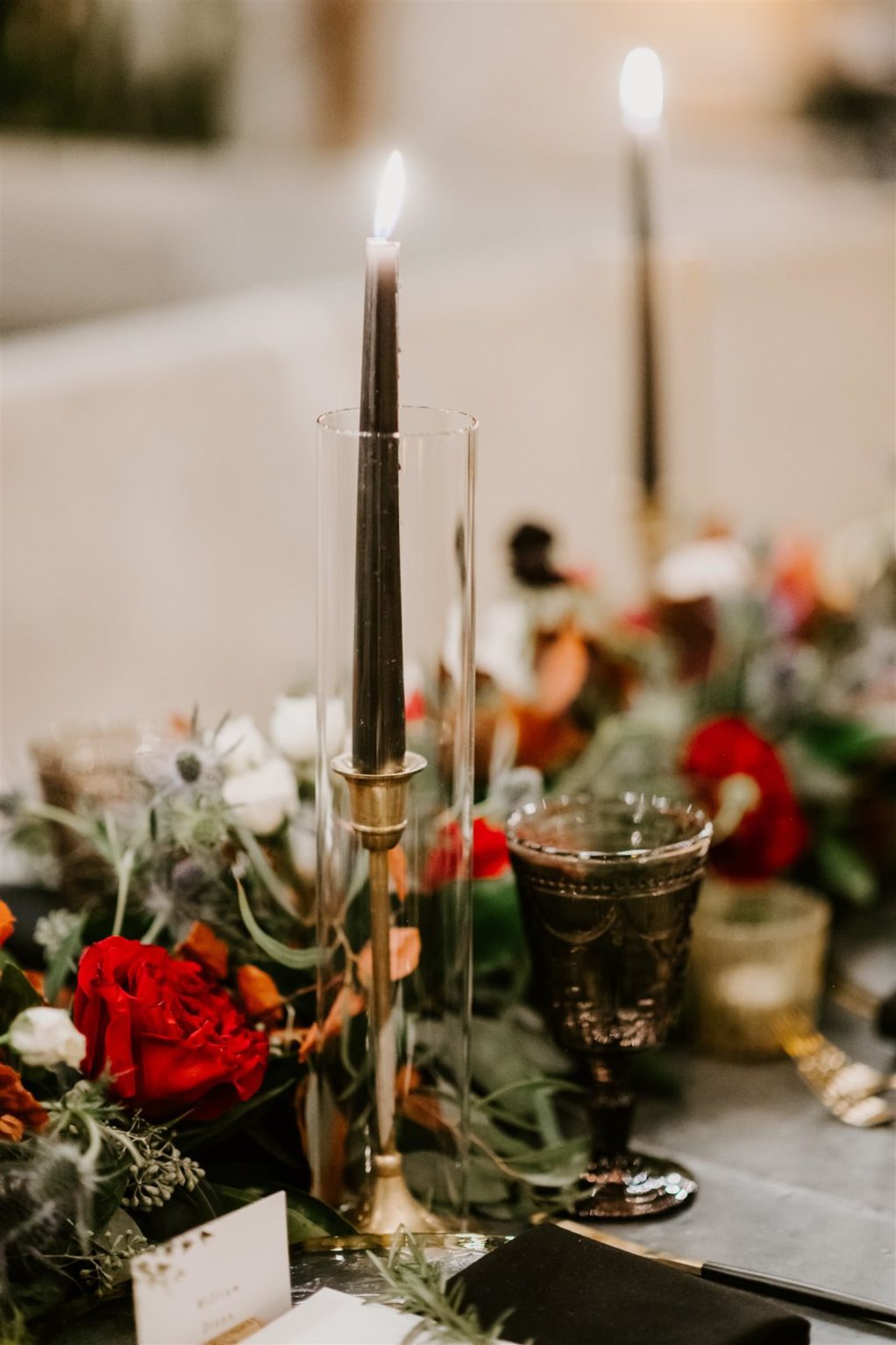 Moody Fall Winter Wedding with Black Taper Candles in Gold Candlesticks with Eucalyptus Greenery Garland Runner with Red Burgundy Wine Roses and Scabiosa