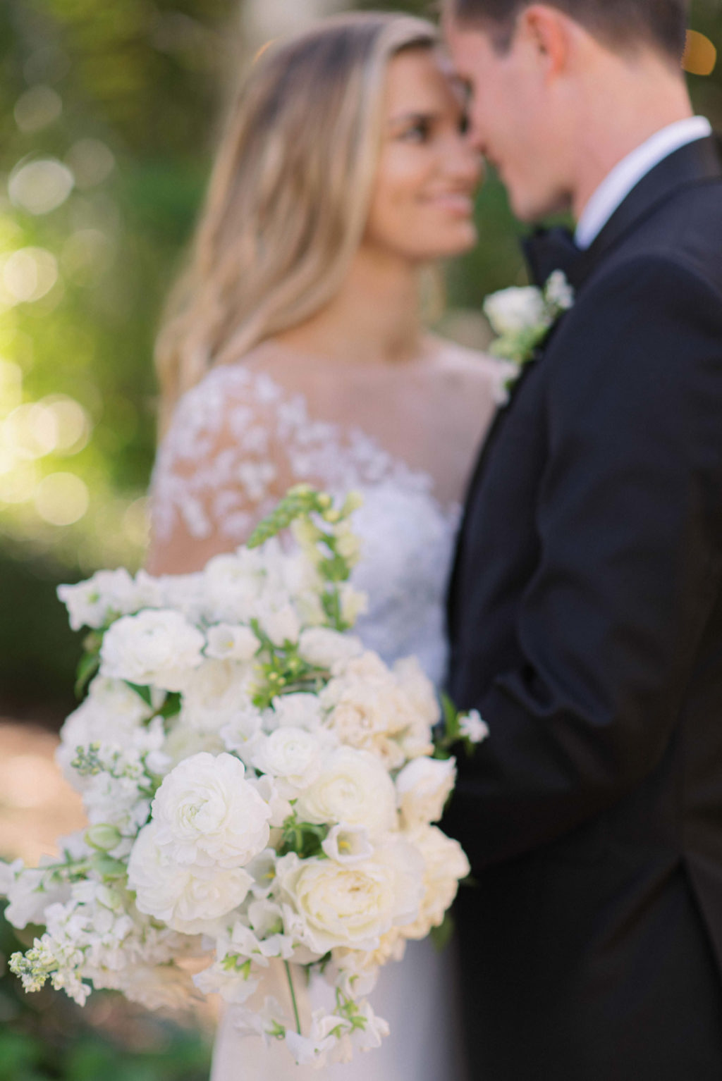 Florida Classic Groom and Bride Holding White Roses and Floral Bouquet