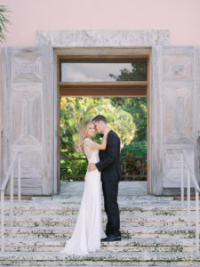 Classic Florida Bride and Groom on Staircase of Tampa Wedding Venue The Gasparilla Inn and Club