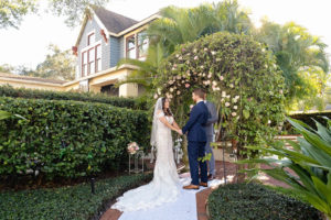 Small Intimate South Tampa Backyard Wedding Ceremony Vox Exchange with Greenery Ceremony Arch | South Tampa Wedding Florist Bride N Blooms Wholesale Design