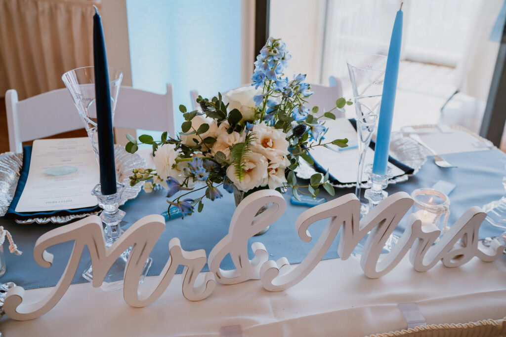 Acrylic White Mr. & Mrs. Sign on Wedding Sweetheart Table with Dusty Blue Coastal Decor