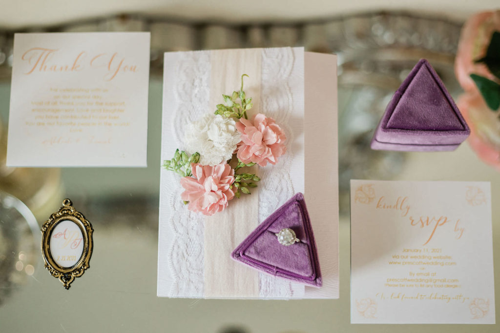 Lace and Blush Wedding Invitation with Floral Detail | Halo Engagement Ring in Purple Velvet Ring Box