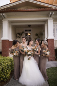 Bridesmaids in Neutral Taupe Mix and Match Bridesmaid Dresses Next to the Bride Portrait | Bohemian Inspired Floral Bouquets with Burnt Orange, Cream and Greenery | Paloma Blanca, Overskirt: Hayley Paige | Bridesmaids in Show Me Your MuMu