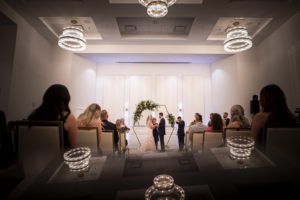 Florida Bride and Groom Exchanging Wedding Vows During Ballroom Ceremony, Gold Geometric Hexagonal Arch with Floral Arrangements | Tampa Bay Wedding Planner Coastal Coordinating | Wedding Venue The Karol Hotel