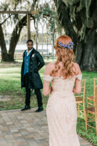 Vintage Bride in Off the Shoulder Fitted Lace Wedding Gown | Arden Bridal and Boutique Tampa | Walking Down the Aisle Portrait