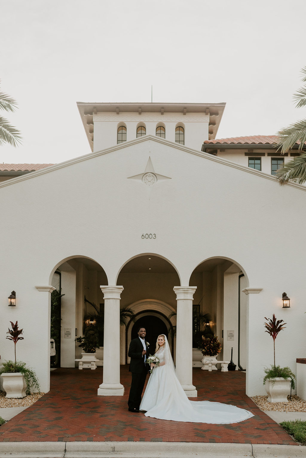 Timeless Elegant Bride and Groom Outside Tampa Bay Wedding Venue Westshore Yacht Club