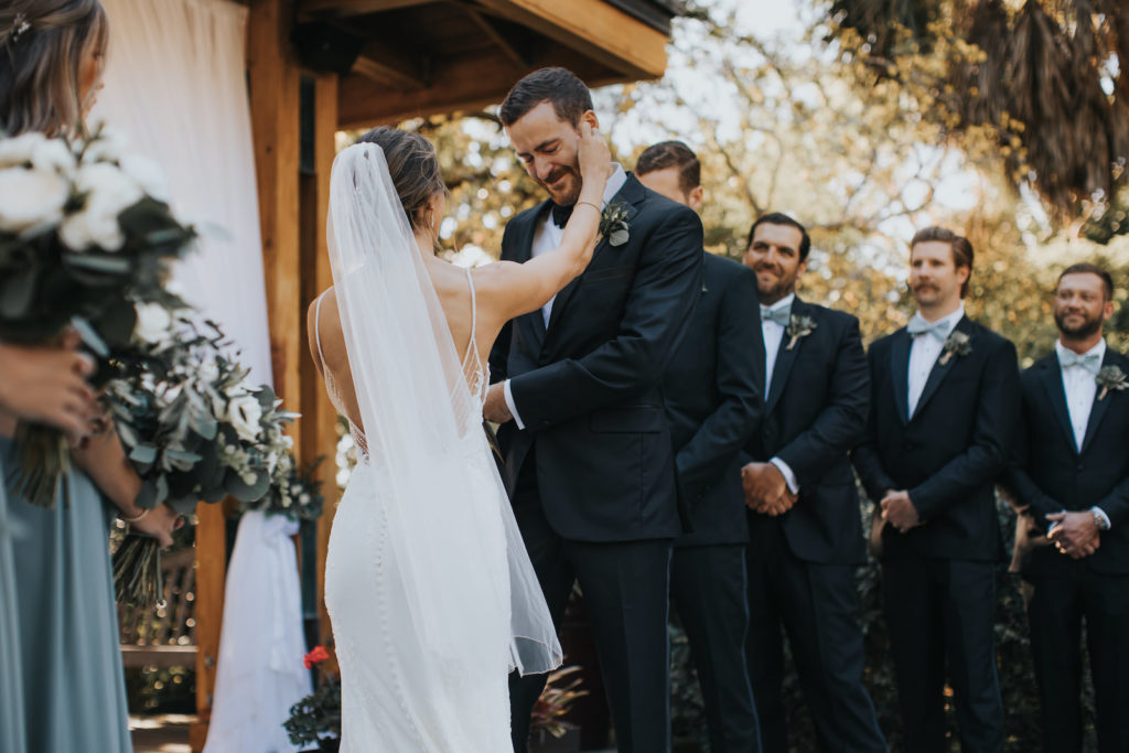 Bride and Groom Exchange Vows | Outdoor Botanical Garden Gazebo Wedding Ceremony with Draping | Sarasota Wedding Venue Selby Gardens