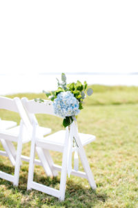 White Ceremony Folding Wedding Chairs | Blue and White Hydrangea Floral Decor | St. Pete Rental Company Gabro Event Services