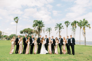 Wedding Party Group Photo | Bridesmaids in Matching One Shoulder Rose Gold Sequin Dresses, Groomsmen in Black Tuxedos, Bride and Groom | Tampa Bay Wedding Photographer Kera Photography