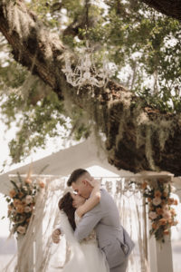 Bride and Groom First Kiss at Bohemian Wedding Ceremony | Florida Waterfront Wedding Ceremony | Sarasota Wedding Photographer Alisa Sue Photography