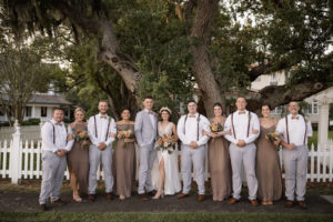 Wedding Bridal Party Bridesmaids in Taupe and Groomsmen's in Gray and Groomsmen in Suspenders and Bowties Wedding Portrait | Bridesmaids Dresses Show Me Your MuMu