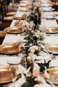 Gold Chargers with Floral and Greenery Centerpieces for Wedding Feasting Tablescape | Tampa Bay Rental Company Kate Ryan Event Rentals