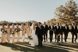 Timeless Neutral Bride, Groom,Bridesmaids in Silky Matching Champagne Gold Dresses and Groomsmen in Black Suits