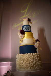 Six Tier Navy Blue, White, and Gold Round Wedding Cake with Monogram and Ruffled Tier | Dessert Inspiration