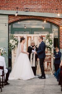 Bride and Groom Exchange Vows | Outdoor Industrial St. Petersburg Wedding