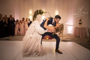 Bride and Groom First Dance with White Dance Floor | St. Pete Wedding Venue The Karol | Dance Floor Kate Ryan Event Rentals