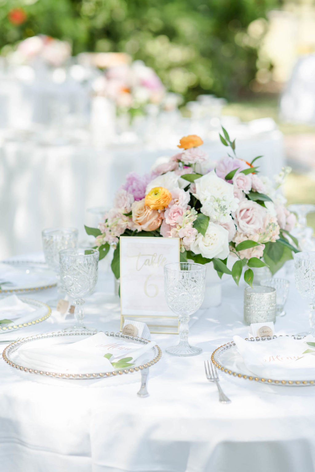 Pastel White and Blush Pink Rose Centerpiece with Greenery and Clear Glass Beaded Wedding Chargers | Romantic Garden Wedding Reception Ideas | Tampa Bay Rental Company Outside the Box Event Rentals