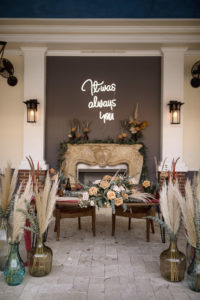 Wedding Neon Sign and Pampas Leaves in Large Clear Vases with Greenery | Boho Wedding Reception Décor with Sweetheart Table | Kate Ryan Event Rentals | Sarasota Wedding Planner Kelly Kennedy Weddings and Events