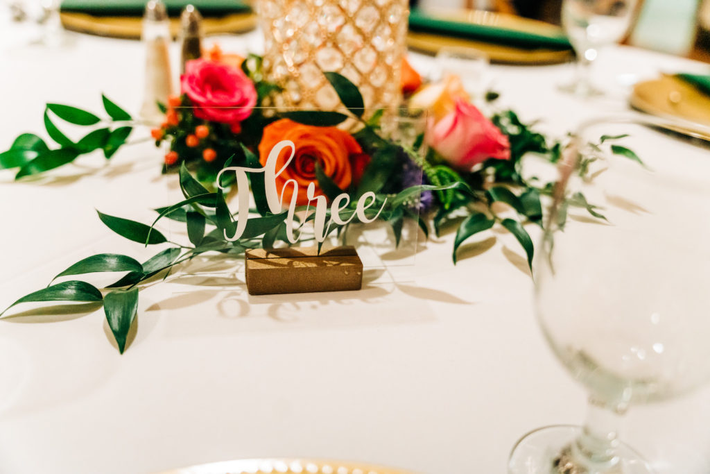 Gold Rustic Wedding Table Numbers with Floral Centerpieces | Garden Wedding Tablescape Ideas with Bright Vibrant Pink Flowers and Greenery