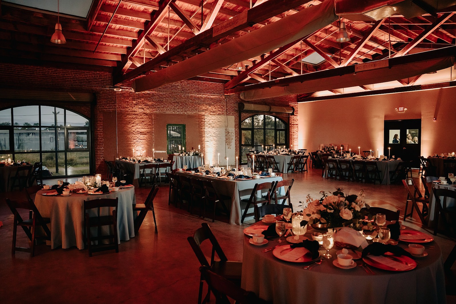 Industrial Indoor Wedding Reception Blue Linens and Wooden Chairs | Draping by Florida Gabro Event Rental Services