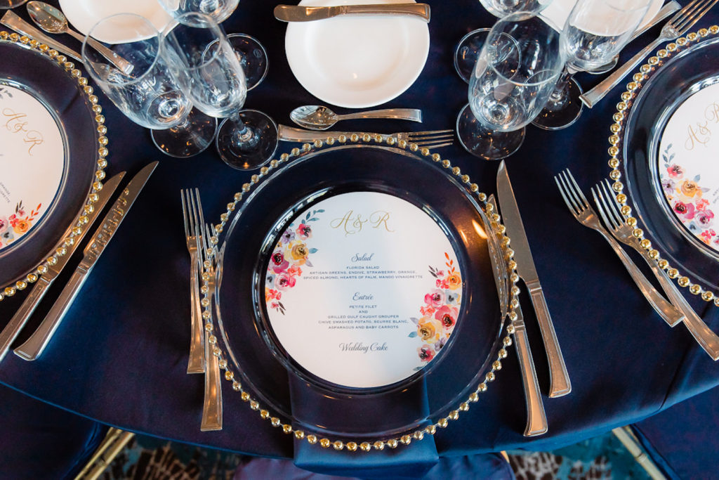 Elegant Wedding Reception Decor, Navy Blue Table Linens, Clear and Gold Beaded Chargers, Round Custom Floral Menus