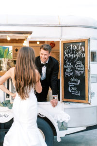Groom Looking At Bride from Inside Mobile Bar Cart | Tampa Bay Wedding Photographer Kera Photography | Wedding Hair and Makeup Femme Akoi Beauty Studio