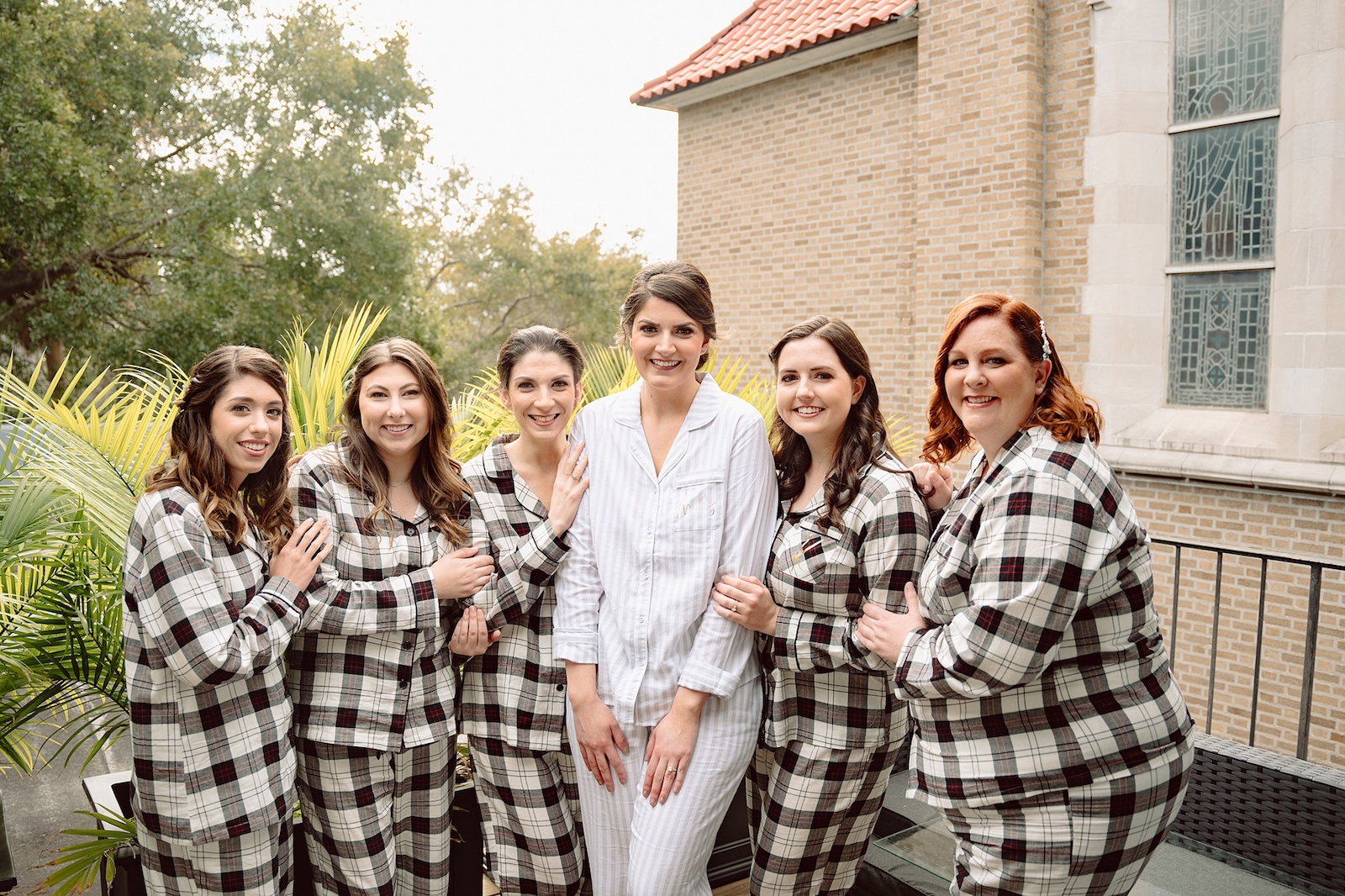 Bride and Bridal Party Getting Ready in Matching Flannel Wedding Portrait