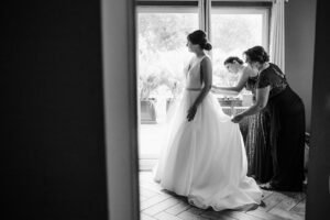 Mother of the Bride and Maid of Honor Helps Bride Get Ready Wedding Portrait in Black and White