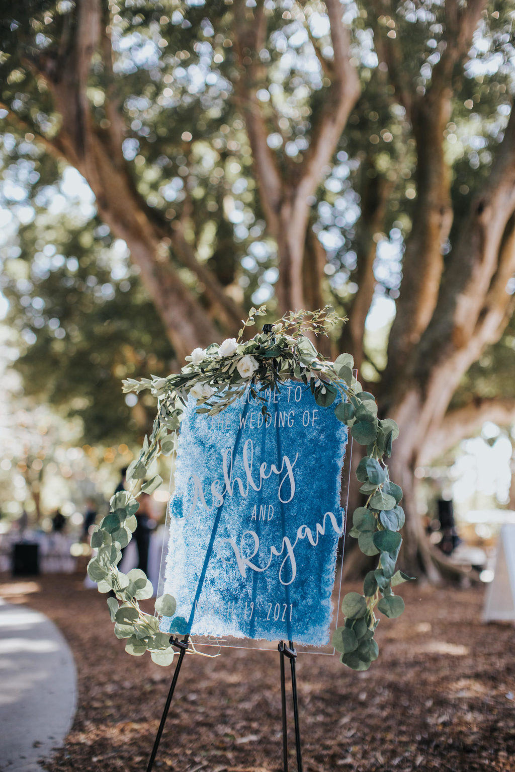 Blue Wedding Ceremony Welcome Sign with Greenery