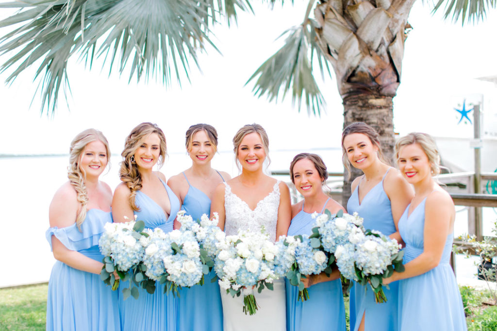 Bride with Bridesmaids in Mix and Match Dusty Blue Floor Length Dresses with White and Blue Hydrangea Wedding Bouquet