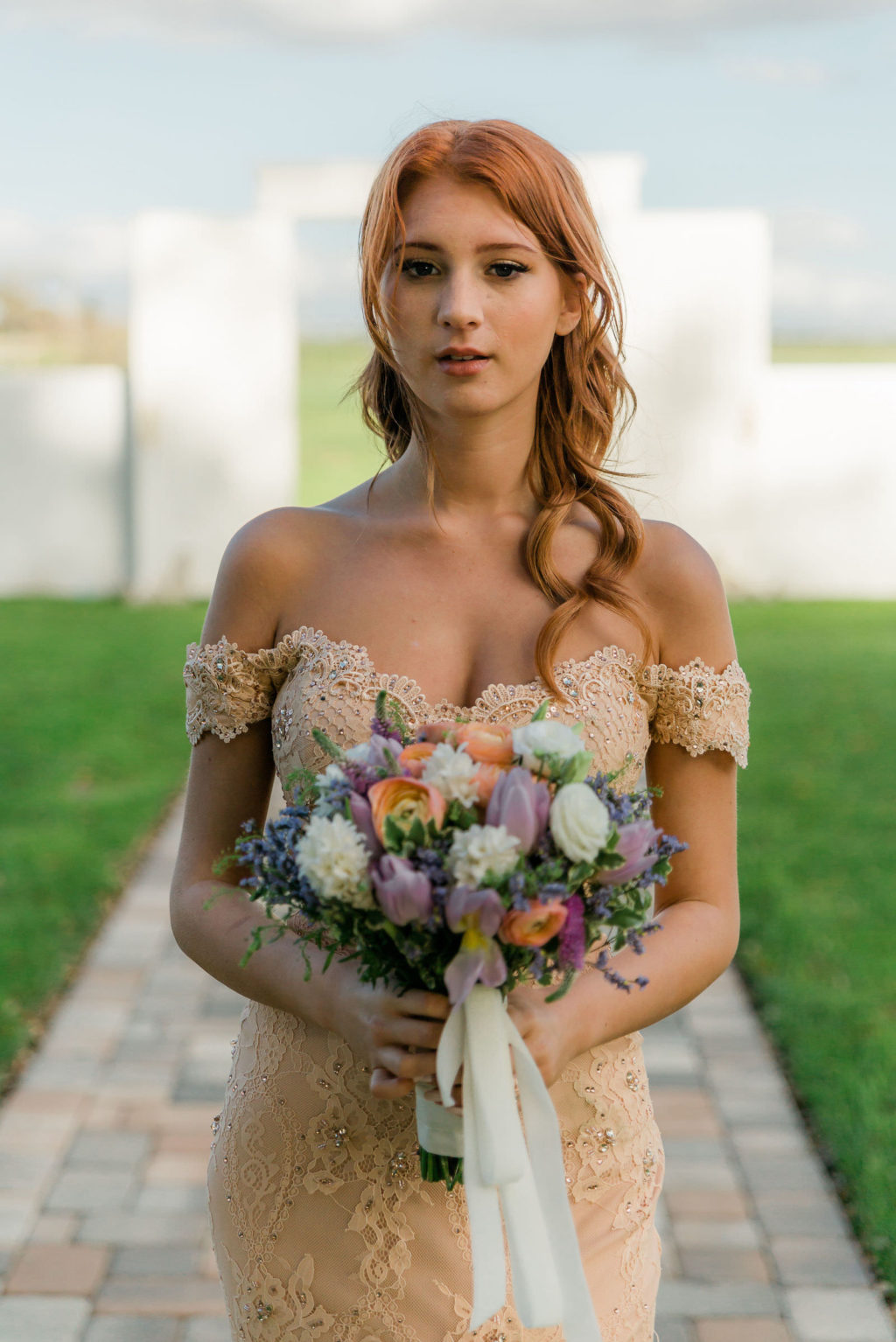 Vintage Bride in Off the Shoulder Fitted Lace Wedding Gown | Arden Bridal and Boutique Tampa | Pastel White, Purple, and Peach Floral Bouquet with Greenery