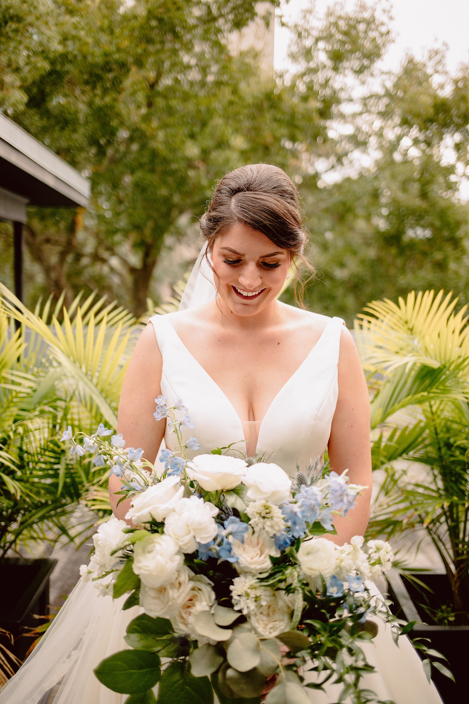 Bride with White and Dusty Blue Wedding Bouquet Up Close Portrait | Tampa Hair and Makeup Artist Femme Akoi