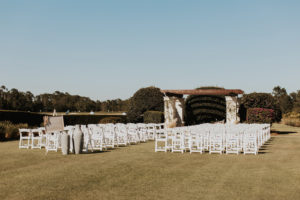 Outdoor Golf Course Wedding Ceremony Decor, Pergola, White Folding Chairs | Bradenton Wedding Venue The Concession Golf Club