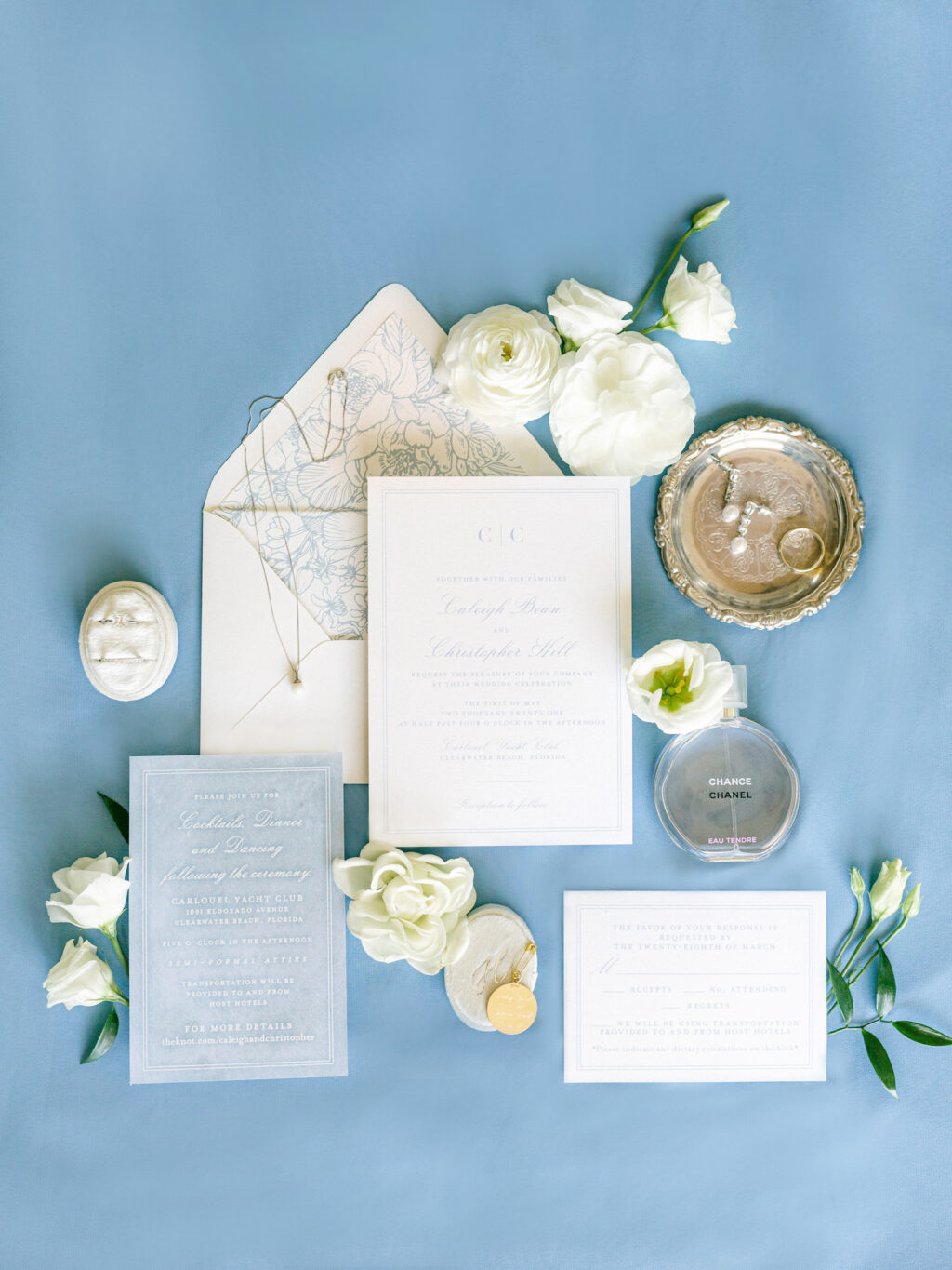 Slate Blue Florida Wedding Invitation Suite, Ivory Stationery with Dusty Blue Accents, Oval Ring Box, Chance Chanel Perfume Bottle, Pearl Teardrop Earrings, Pearl Pendent Necklace | Tampa Bay Florist Bruce Wayne Florals