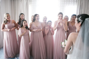 Bride Reveal to Bridesmaids Wedding Portrait | Bridesmaids in Blush Pink Floor Length Wedding Dresses | Jenny Yoo