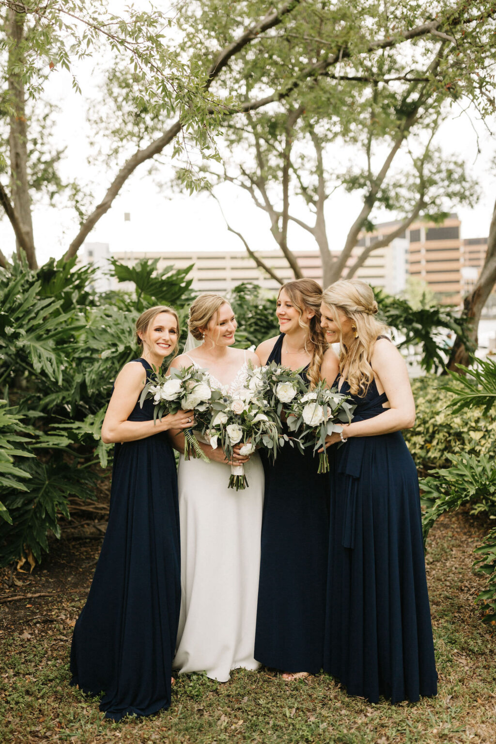 Bride and Bridesmaid Portrait with Greenery and Ivory Bouquets