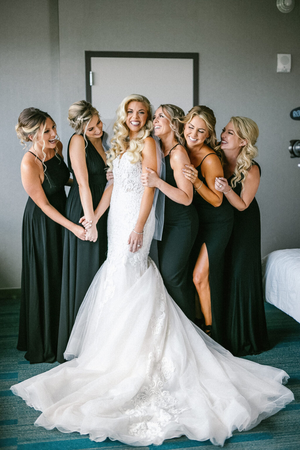 Modern Elegant Florida Bride in Romantic Lace and Tulle Skirt Mermaid Maggie Soterro Wedding Dress with Bridesmaids in Mix and Match Black Dresses | Tampa Bay Wedding Hair and Makeup Femme Akoi Beauty Studio