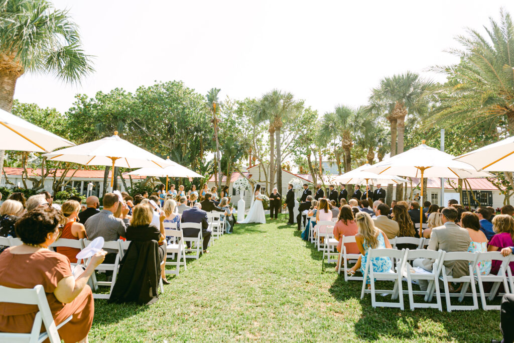 Classic Tampa Bay Outdoor Wedding Ceremony, Tropical Country Club with Umbrella's for Shade, White Floral Arrangements | Carlouel Yacht Club | Florida Wedding Planner Parties A La Carte | Clearwater Florist Bruce Wayne Florals