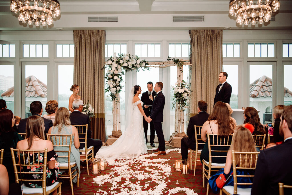 Romantic Indoor Ballroom Wedding Ceremony with Gold Chiavari Chairs | St. Pete Rental Company Gabro Event Services | Venue The Birchwood | Tampa Bay Planner Perfecting the Plan