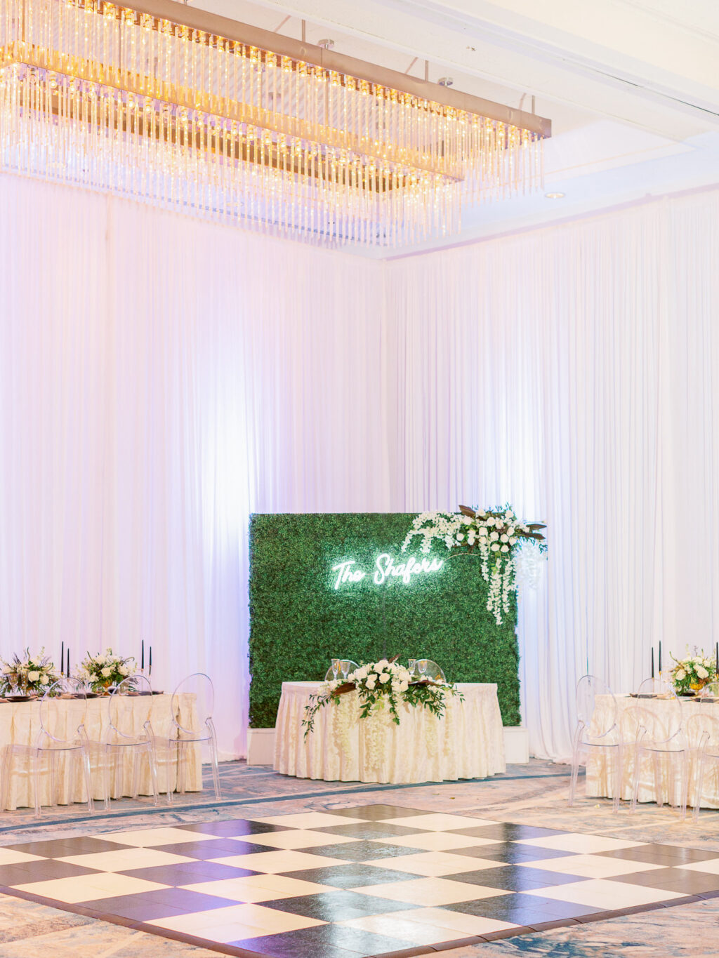 Wedding Reception Dance Floor and Sweetheart Table with Greenery Backdrop and Neon Sign | Hilton Downtown Tampa | Gabro Event Services