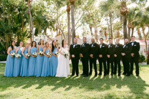 Clearwater Wedding Party at Carlouel Yacht Club, Bridesmaids Wearing Long Mismatched Slate Blue Dresses, Groomsmen in Class Black Tuxedos and Bow Ties, Bride Wearing Stella York