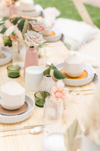 Boho Mid-Century Modern Wedding Decor, Picnic Table Plates with Personalized Coconuts, Small Mix and Match Vases with Single Roses and Dried Leaves | Head Table Design Coastal Coordinating | Table Rentals Kate Ryan Event Rentals | Big Fake Wedding Tampa