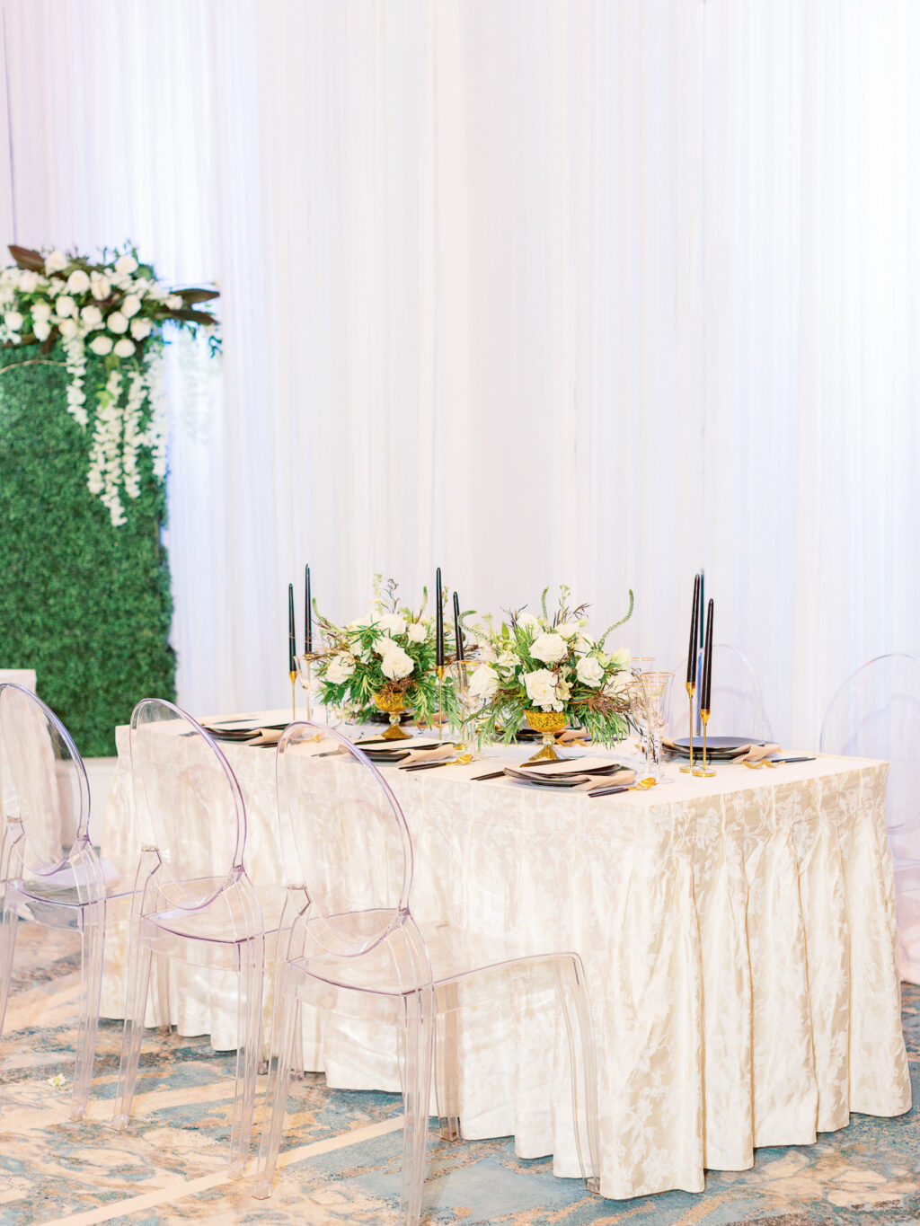 Elegant Wedding Reception Tablescape with White Linen and Ghost Chairs and Greenery Backdrop | Tampa Wedding Rental Company A Chair Affair