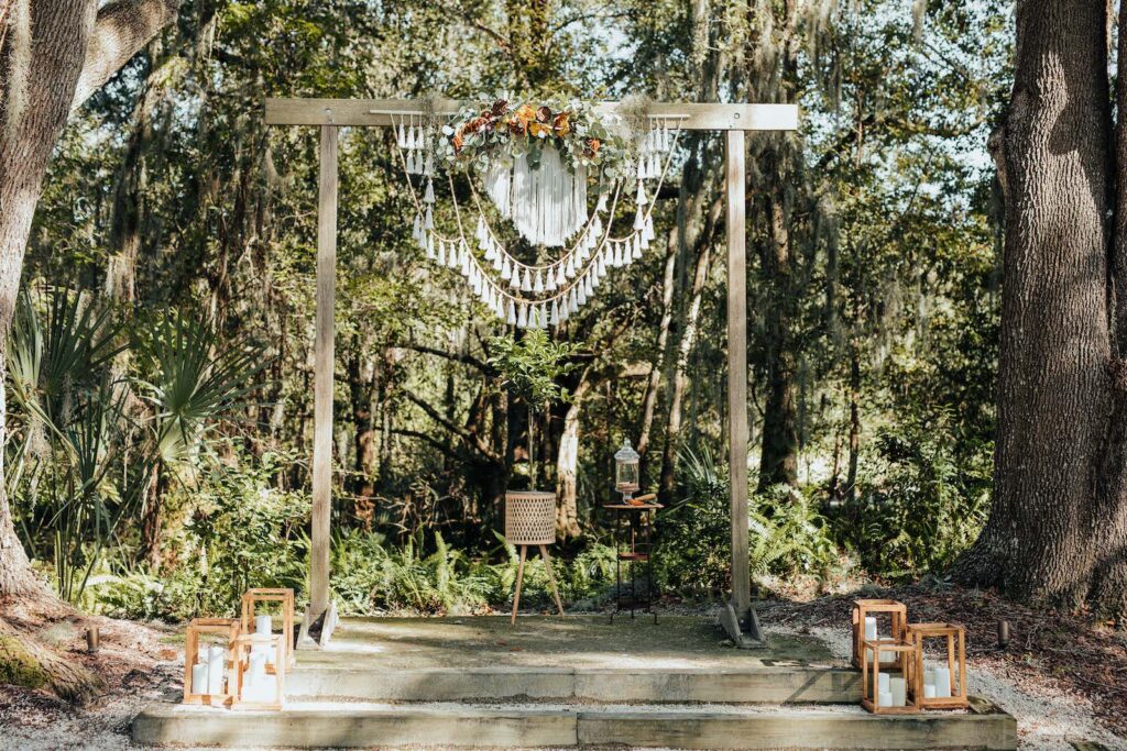 Outdoor Bohemian Wedding Ceremony with White Garden Chairs | Wooden Arch with Macrame Crochet Decor | Tampa Wedding Venue Paradise Springs