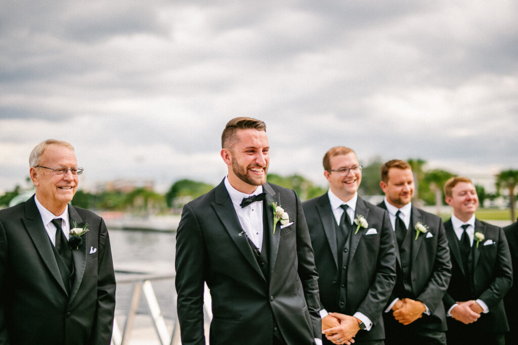 Tampa Modern Elegant Groom Reaction to Seeing Bride Walking Down the Wedding Ceremony Aisle
