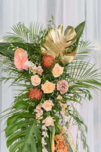 Elegant Tropical Floral Wedding Ceremony Decor, Gold Painted Monstera Leaves, Palm Fronds, Pink Anthurium, Coral Roses, Pin Cushion Proteas | Tampa Bay Wedding Planner Eventfull Weddings