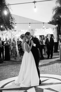 Bride and Groom First Dance Outdoor Wedding Portrait | Bride in BHLDN Illusion Back Ballgown Wedding Dress with Classic Updo and Natural Makeup | Tampa Bay Hair and Makeup Artist Femme Akoi Beauty Studio | Reception Venue Tampa Yacht & Country Club