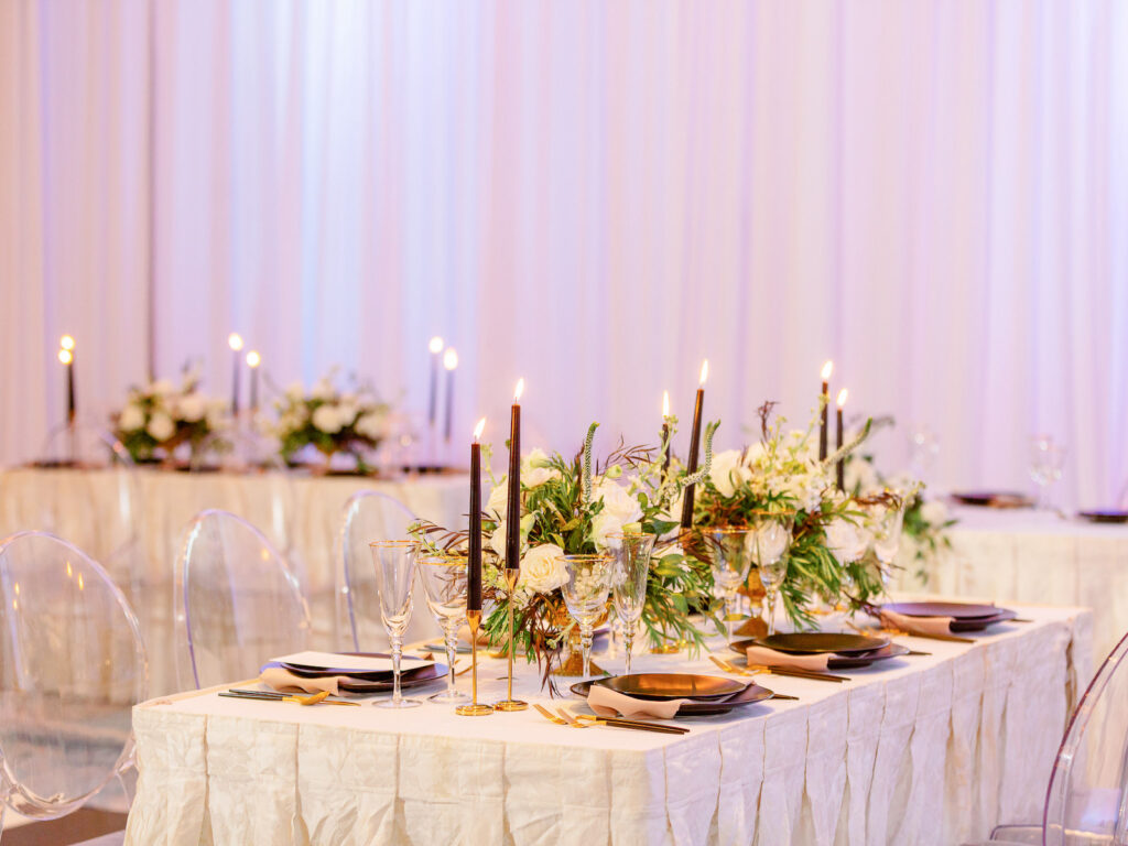 Classic Wedding Reception Tablescape with White Floral Centerpieces and Tall Black Candles | Florida Rental Company A Chair Affair